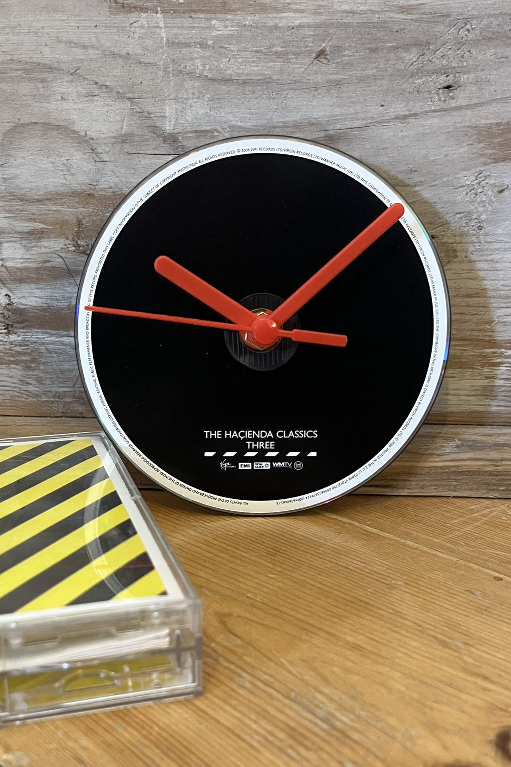 Hacienda Classics CD wall clock with minimalist Manchester‑inspired artwork by Pop Vulture