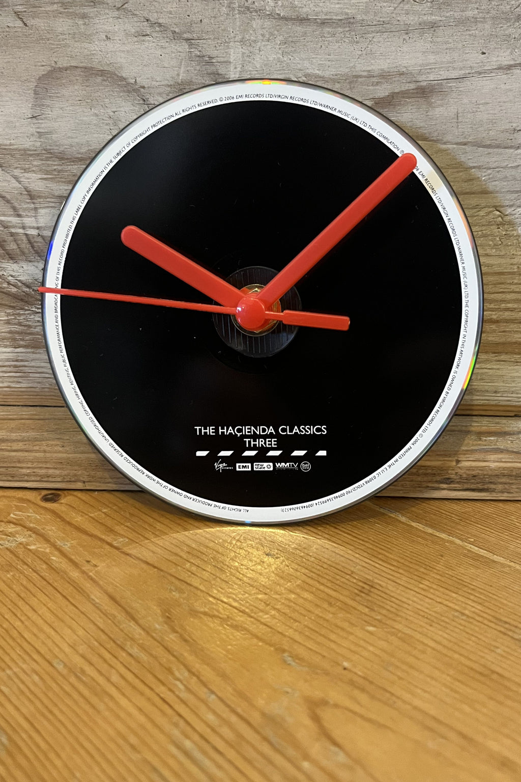 Close‑up of Hacienda Classics CD clock showing bold minimalist design
