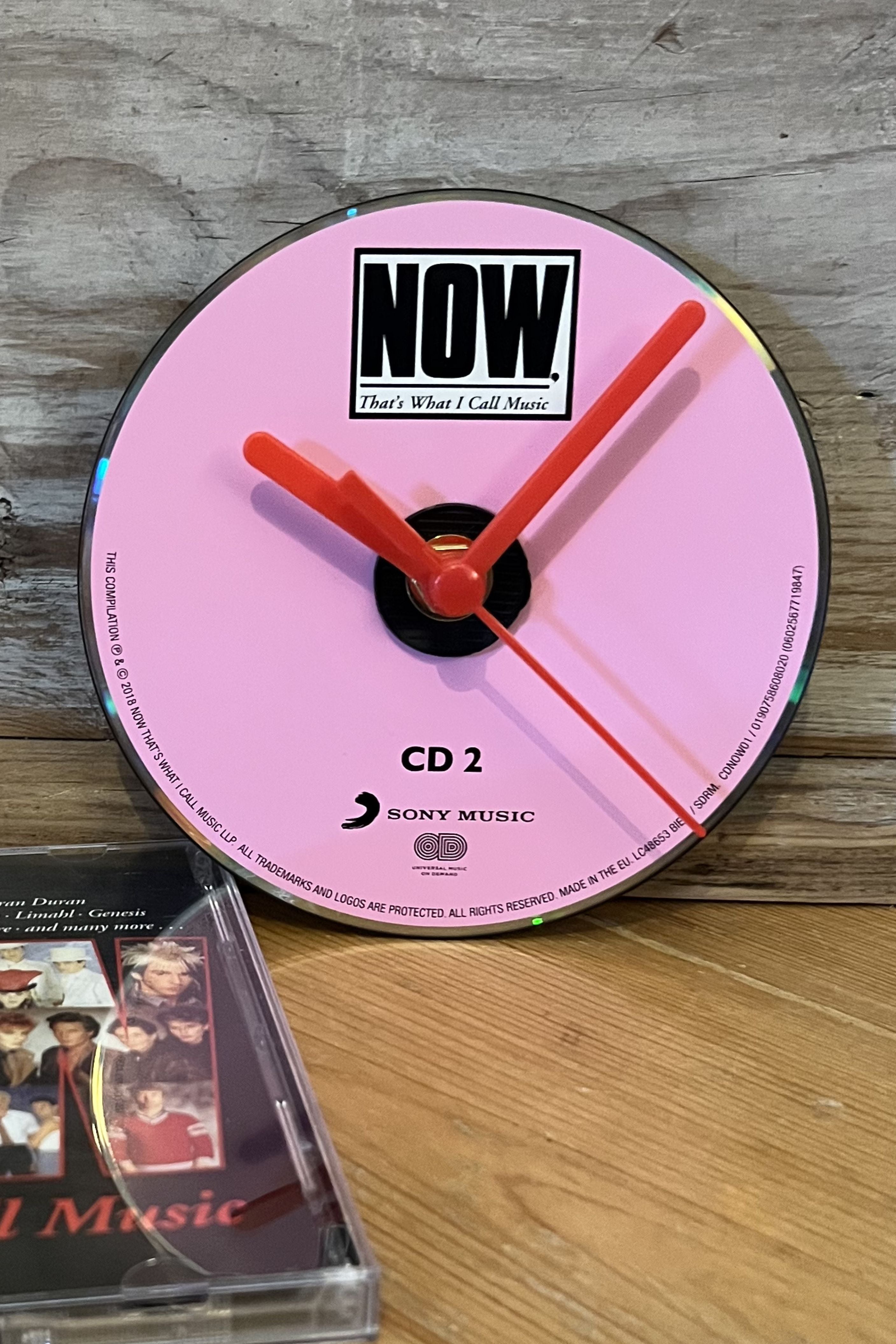 Now That’s What I Call Music CD wall clock with colourful classic artwork by Pop Vulture