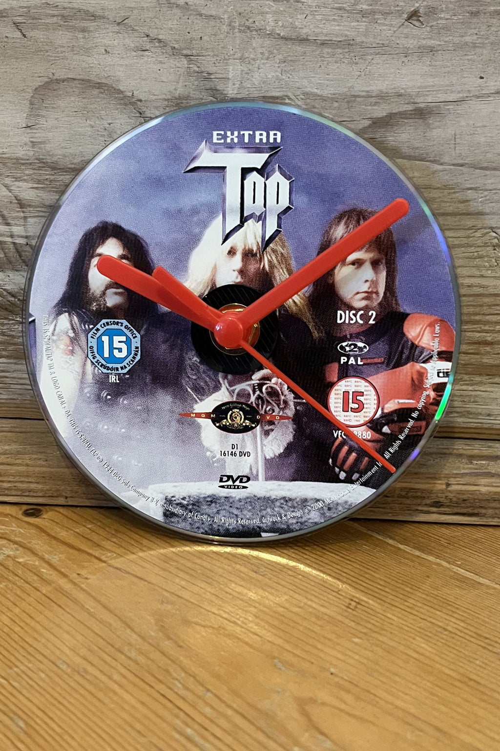 Close‑up of Spinal Tap DVD clock showing iconic logo design